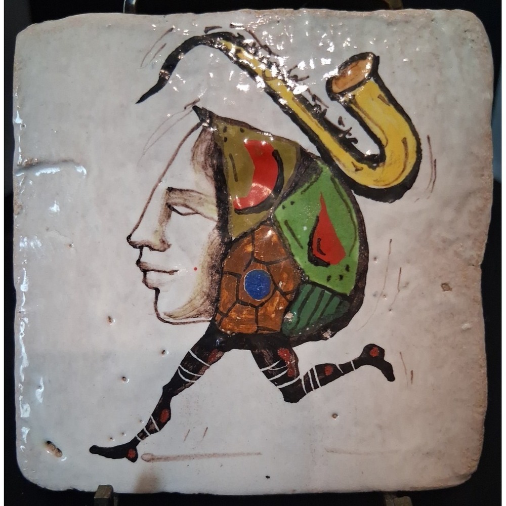 Signed Hand-Painted whimsical design of a human face and body‎ with saxophone